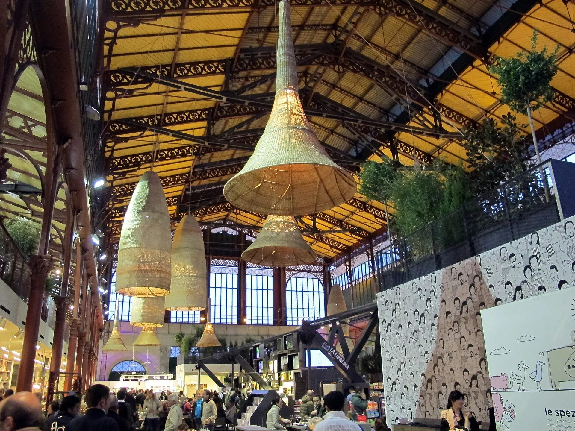 Hanging lamps, iron-and-glass structure and upstairs counters of Florence's Mercato Centrale.