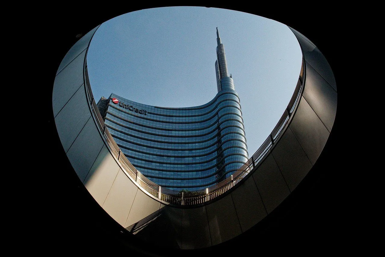 UniCredit Tower seen through a circular opening with stairs at Piazza Gae Aulenti, in Milan.